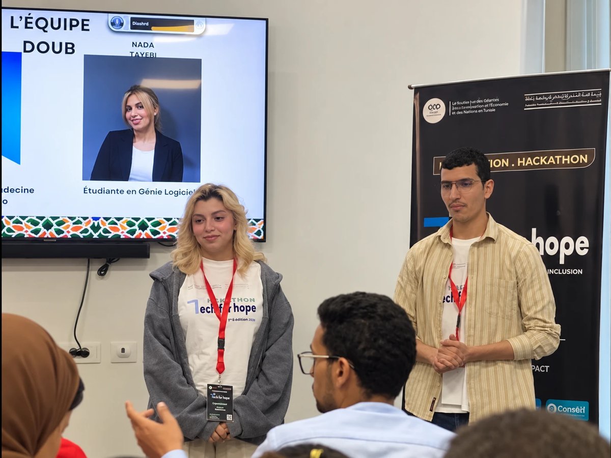 Nada Tayebi and her teammate presenting team DOUB