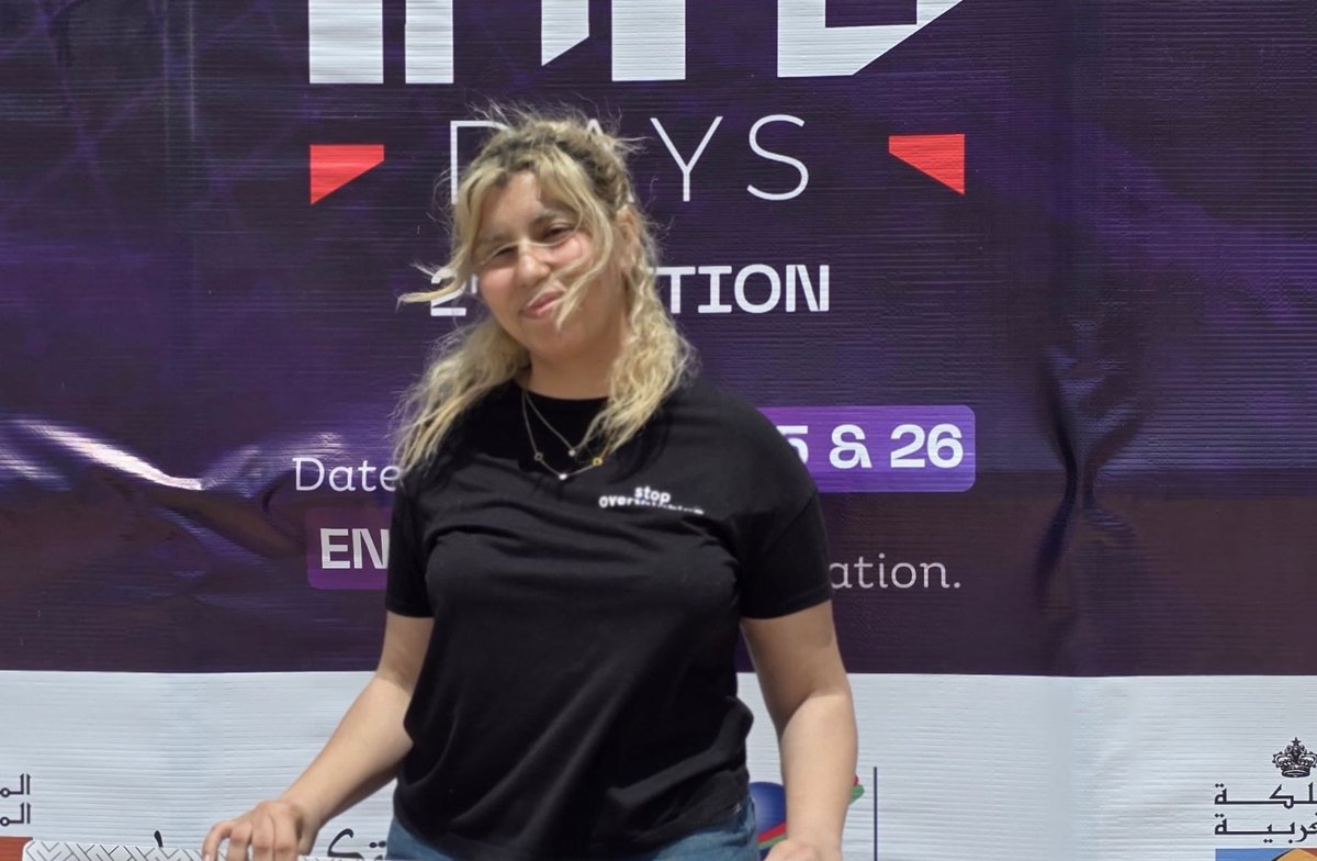 Nada holding the Info Days hackathon board